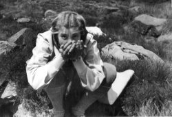 Didy Holdsworth drinking on the moor 1946