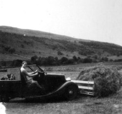 Bill Holdsworth gathering up the hay, near Scargill House, Kettlewell, 1947