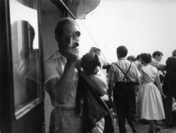 Bill Holdsworth, taking cine photos on the Eiffel Tower in Paris, 1959