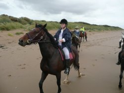 Nicky on 'Amber' Riding on the beach at Bream Sands, Somerset