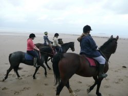 Riding on the beach  at Bream Sands, Somerset