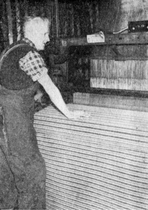 Mr. John Hill weaving some of the fabric at Shaw Lodge Mills