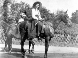Two Girls on horseback, c1910