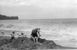 David, Howard, Michael and Bill Holdsworth, Building a sand-castle at Sandsend, Sept 1954