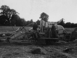 Tony and Irish boy on the 'Lanz' PTO Harvester at Bellinter, 1955